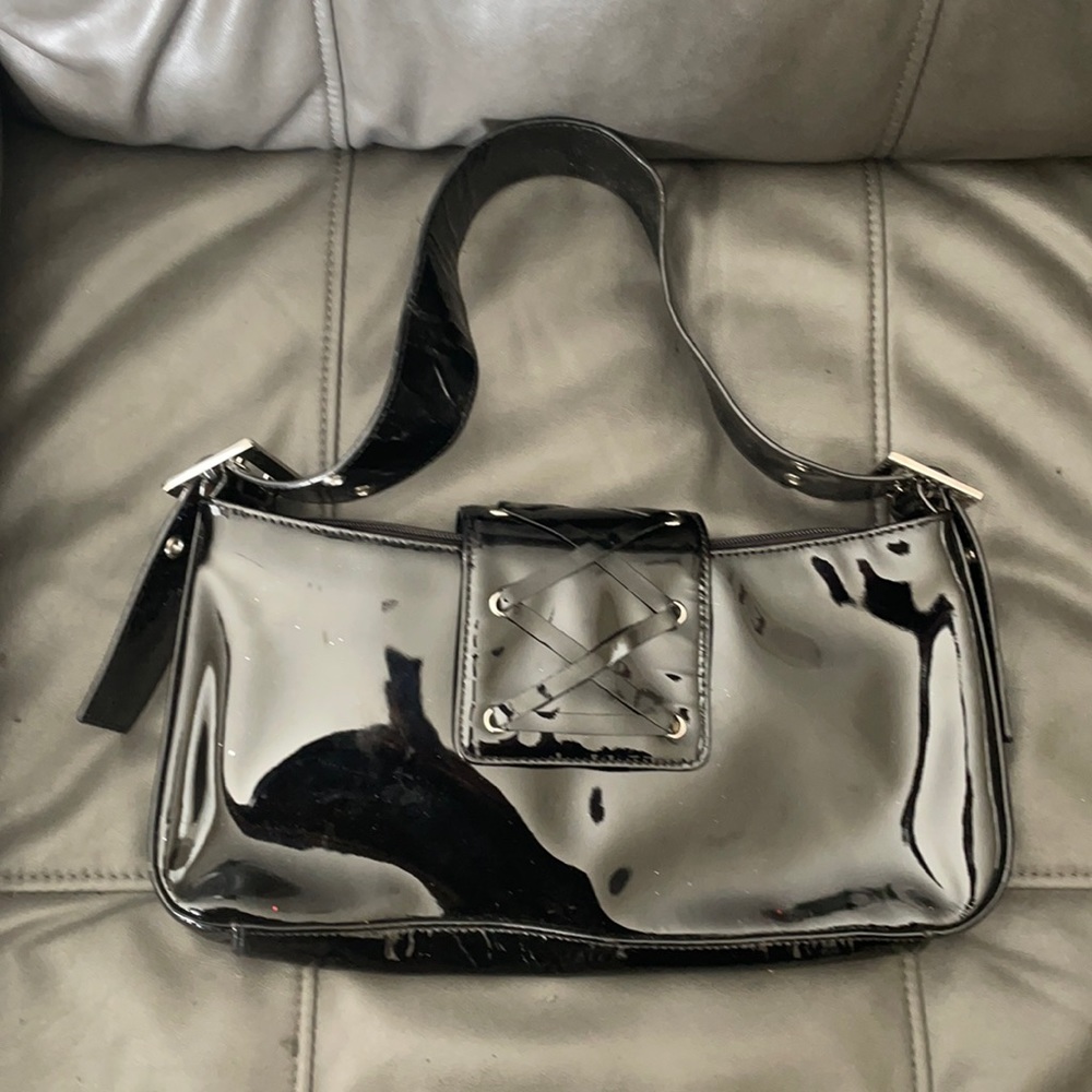 Black patent leather handbag with silver hardware